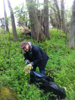 Person performing Nature Cleanup in the woods