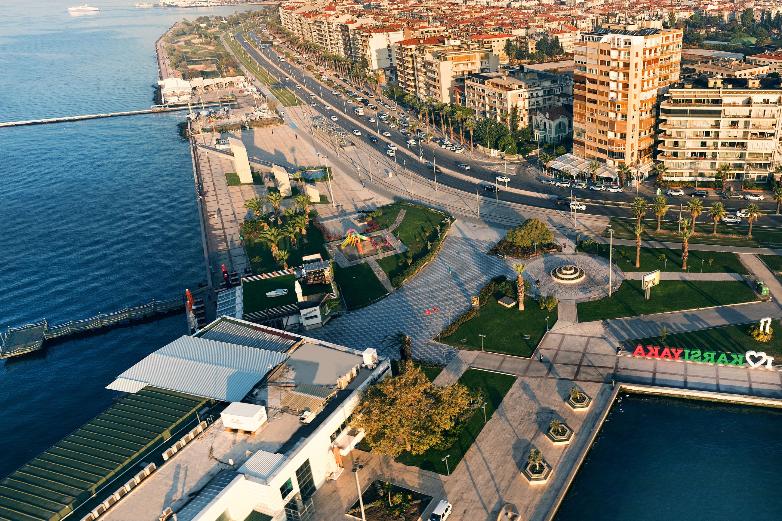The city of Karsiyaka, Turkey, with blue harbor and downtown area.