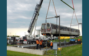Photo of crane lifting metro car