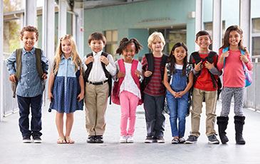 image of school-age children with backpacks