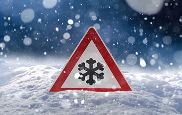 photo of snow and warning sign