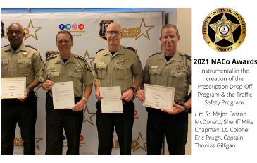 Photo of Sheriff's Office personnel with NACo awards